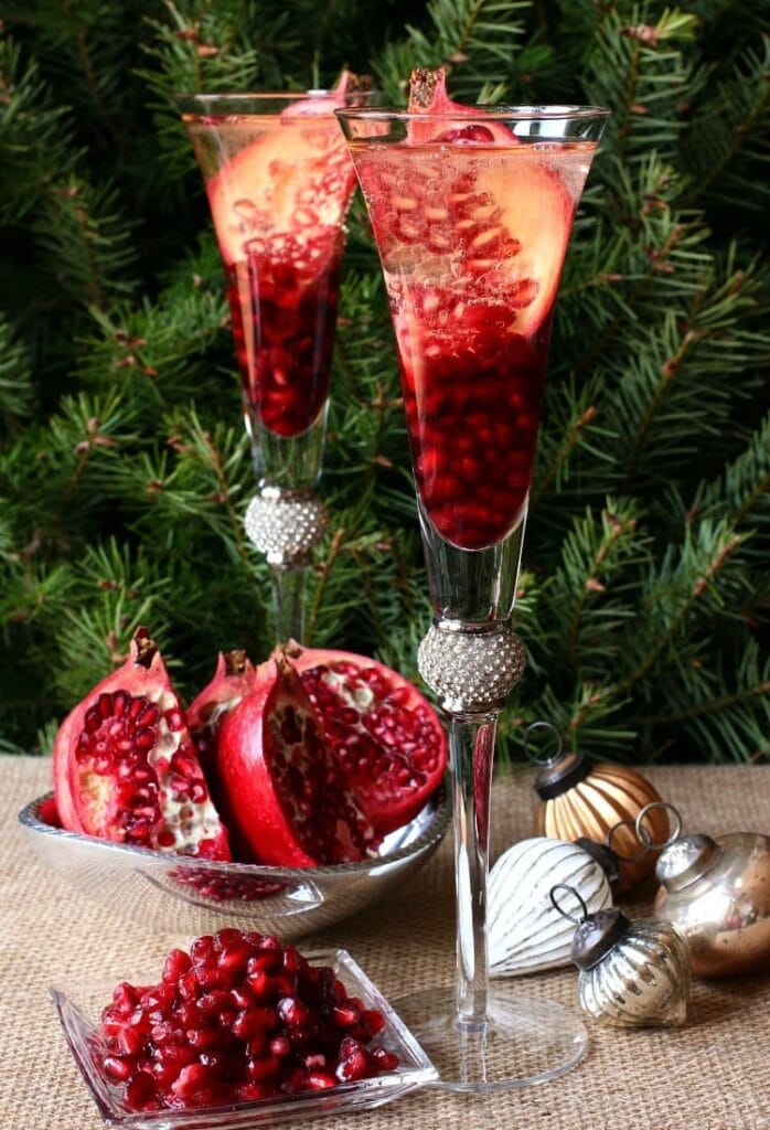 A Prosecco Holiday Pom Pom is a delicious Christmas champagne drink recipe with pomegranate seeds