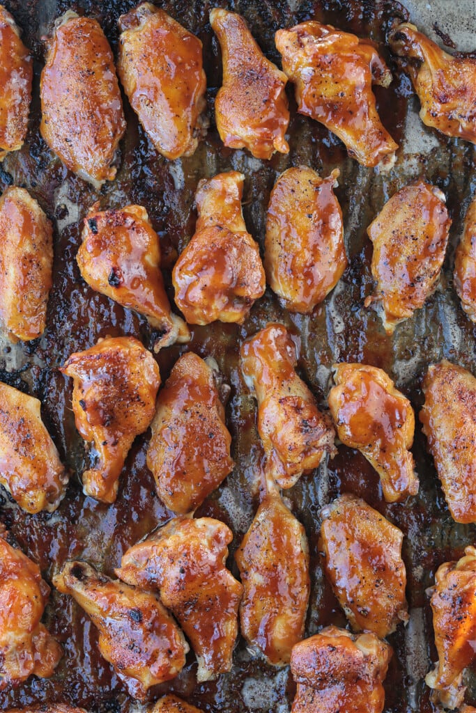 These Asian Chicken Wings are oven baked until tender, with a sticky, sweet addicting sauce. Perfect for appetizers or a fun dinner! baked chicken wings baked with Asian sauce