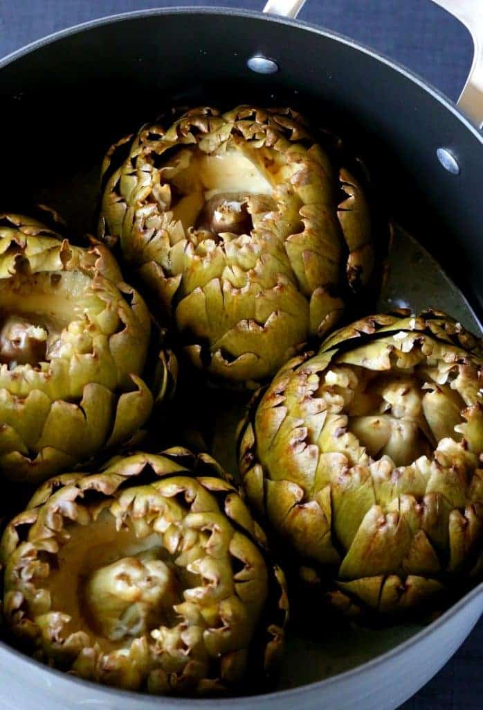 Stuffed Artichokes with Garlic and Fontinella Cheese are super tender when they're done, and filled with cheese!