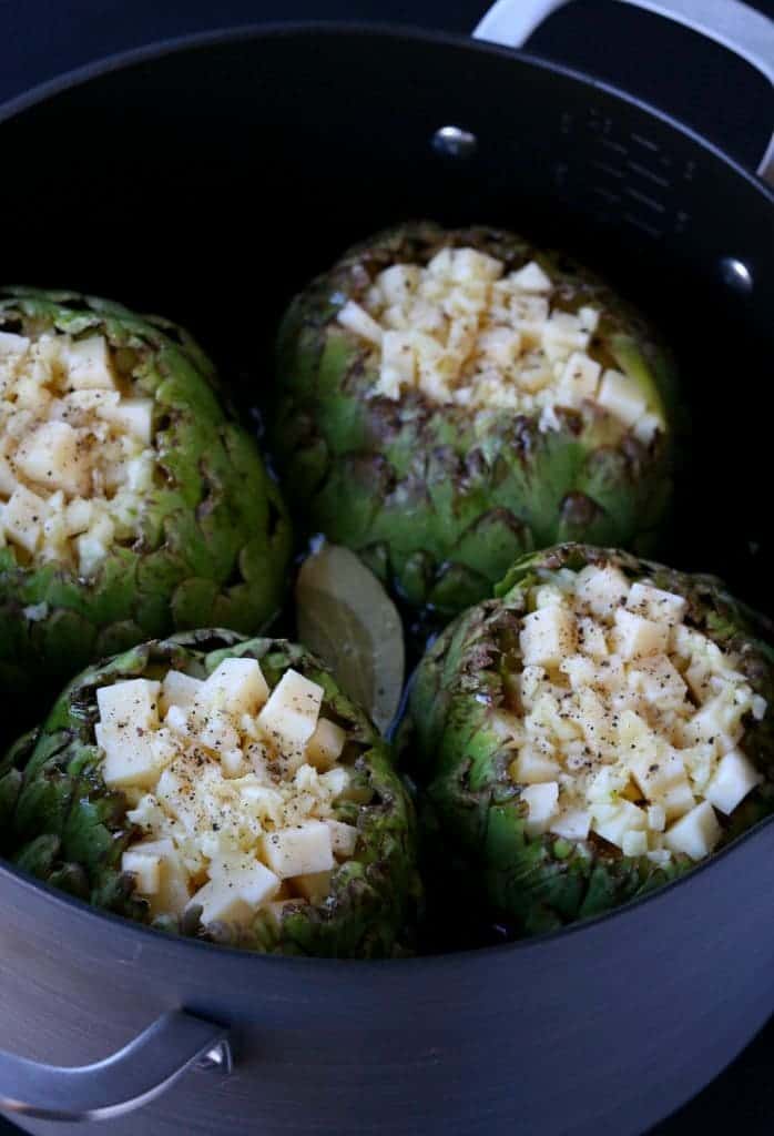 Stuffed Artihokes with Garlic and Fontinella Cheese cook on the stove top for a delicious vegetable side!