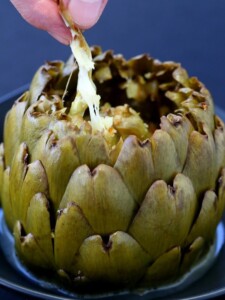 There's tons of flavor - and tons of cheese in these Stuffed Artichokes with Garlic and Fontinella!