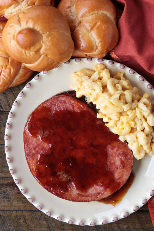 ham steaks on plate with macaroni and cheese