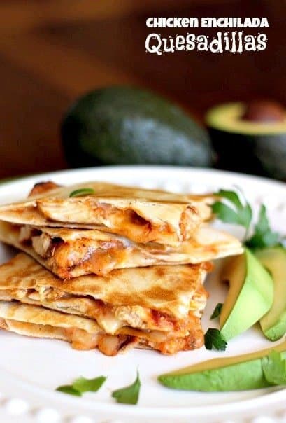 chicken enchilada quesadillas on a serving plate, stacked