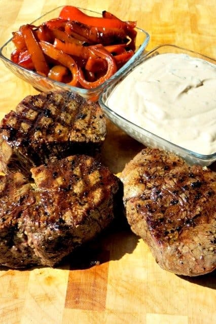 steaks on a board to make steak sandwich