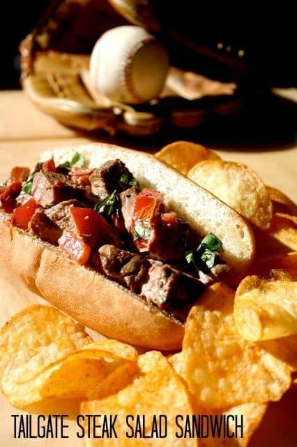 tailgate steak sandwich on a bun with chips