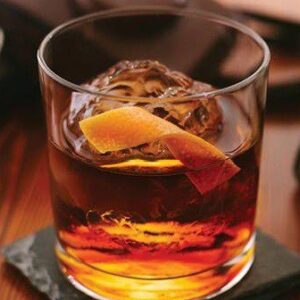 rum cocktail with grapefruit garnish
