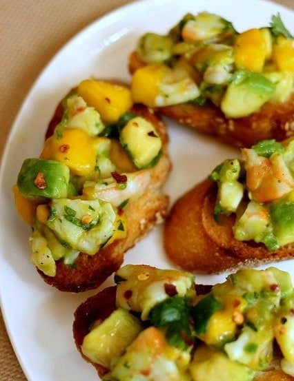 tropical shrimp bruschetta on a platter