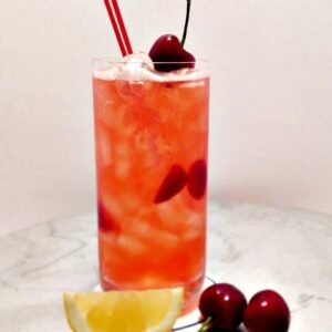 cherry lemonade in glass with straws