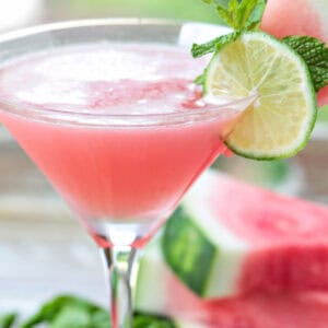 watermelon cosmopolitan with sliced watermelon in background