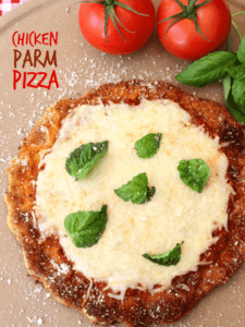 Chicken Parm Pizza with title on a pizza stone