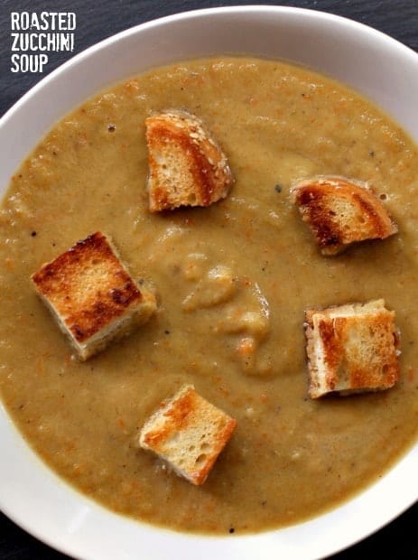 zucchini soup in a bowl with croutons