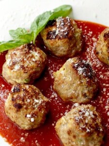 turkey meatballs made with zucchini on a plate with sauce