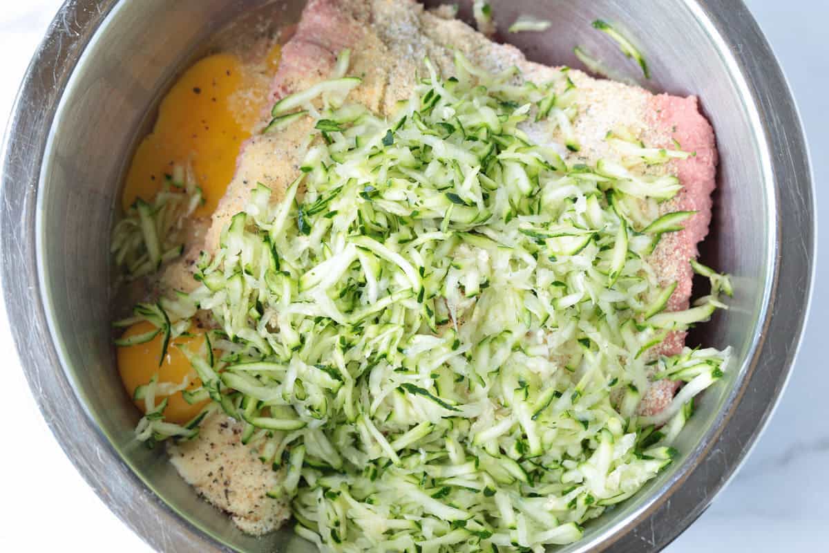 ingredients for turkey zucchini meatballs in a bowl