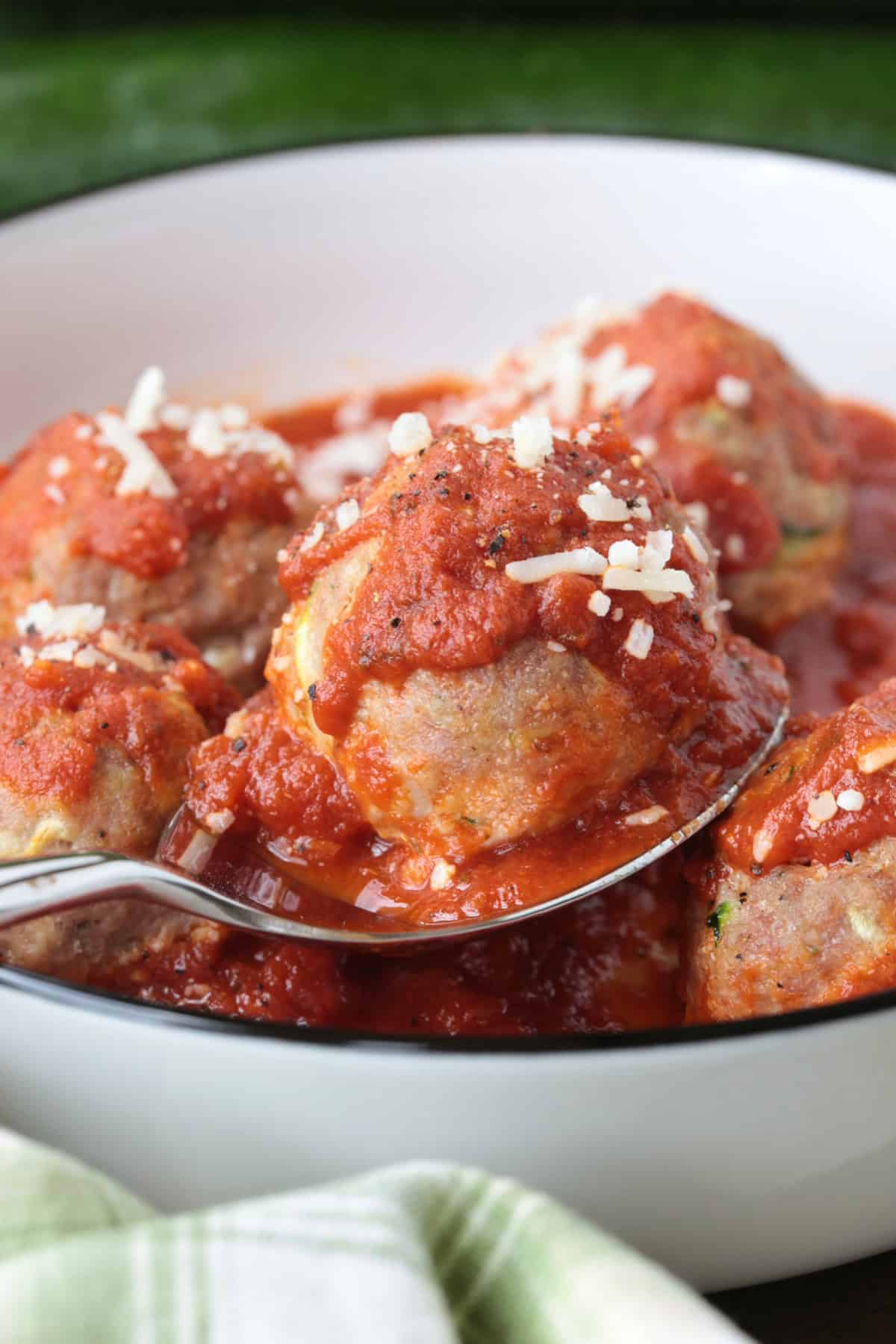turkey meatball on a spoon with sauce
