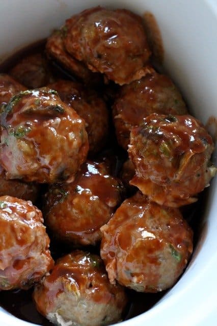 Crock Pot Asian Meatballs are a meatball recipe that's baked then finished in a slow cooker