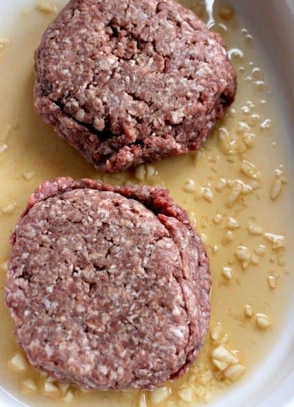 whiskey burgers marinating in garlic and whiskey