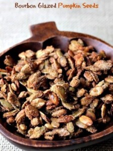 glazed pumpkin seeds in a pumpkin bowl