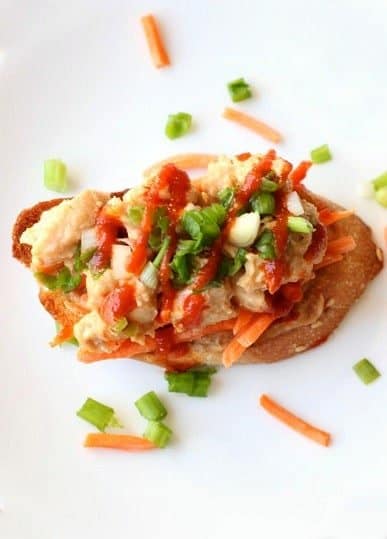 chicken satay bruschetta on a plate