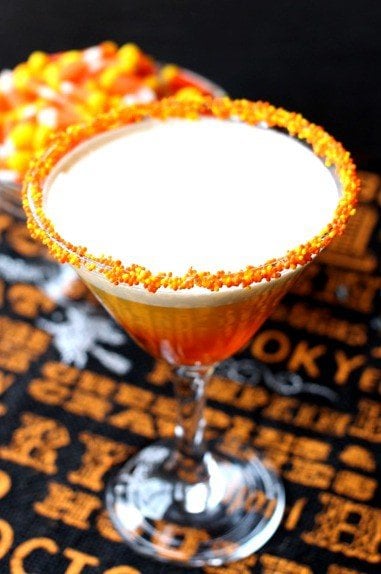 This Candy Corn Martini is WAY too delicious to save for Halloween! This layered martini tastes just like liquid boozy, candy corn! Candy Corn Martini with sugar rim