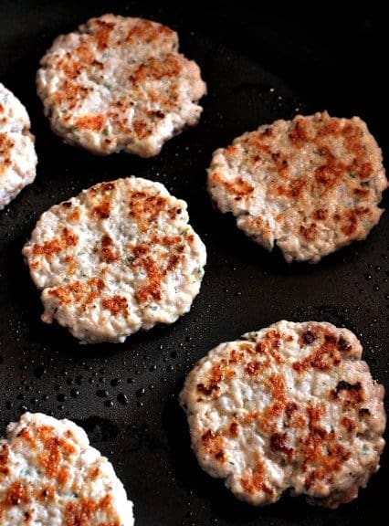 sausage cooking for Sausage and Pancake Breakfast Sandwich