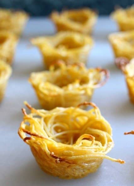Spaghetti and Meatball Cups with Pumpkin Sauce are super fun for the holidays! We love serving these for Thanksgiving appetizers! spaghetti cups cooked