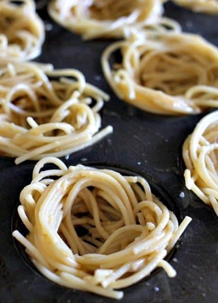 Spaghetti and Meatball Cups with Pumpkin Sauce are super fun for the holidays! We love serving these for Thanksgiving appetizers! making spaghetti cups