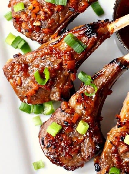 Lamb chops with green onions on top
