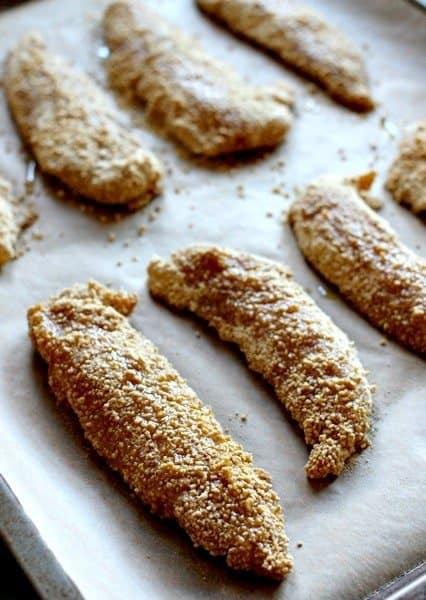 chicken fingers on baking sheet