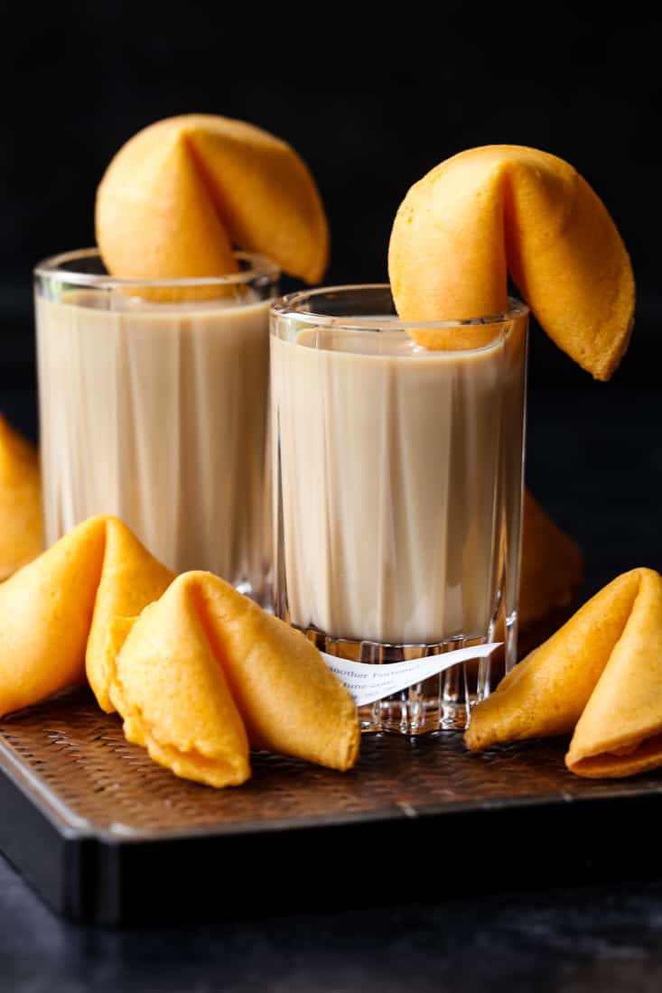 fortune cookie shots on a board with cookies