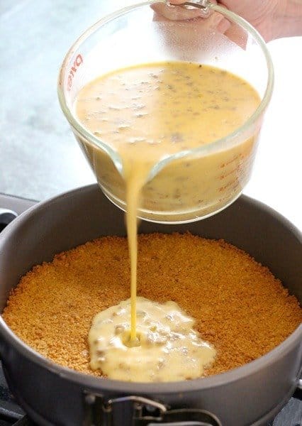 Sausage Tex-Mex Quiche pouring filling