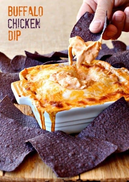 This creamy and spicy Buffalo Chicken Dip is an easy appetizer recipe that only takes 5 minutes of prep! Perfect for game days or any party, just pop it in the oven for a few minutes and it's ready to serve! Buffalo Chicken Dip is an easy appetizer recipe with chicken, cream cheese and hot sauce