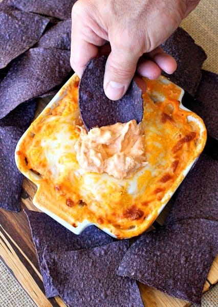 This creamy and spicy Buffalo Chicken Dip is an easy appetizer recipe that only takes 5 minutes of prep! Perfect for game days or any party, just pop it in the oven for a few minutes and it's ready to serve! Buffalo Chicken Dip is an easy appetizer recipe for parties