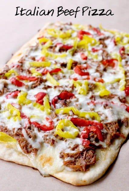 This Italian Beef Pizza has all the flavors of an Italian Beef Sandwich baked on a pizza! A fun recipe to serve at game days and parties! italian beef pizza