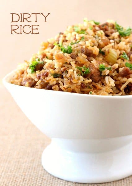Our Easy Dirty Rice Recipe is done in about 30 minutes! A hearty, classic rice recipe that can be served as a side or even a main course! dirty rice in a white bowl