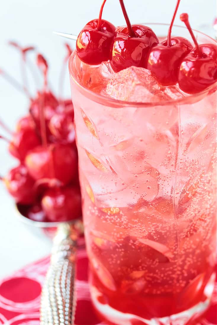 Dirty Shirley cocktail close up with cherries