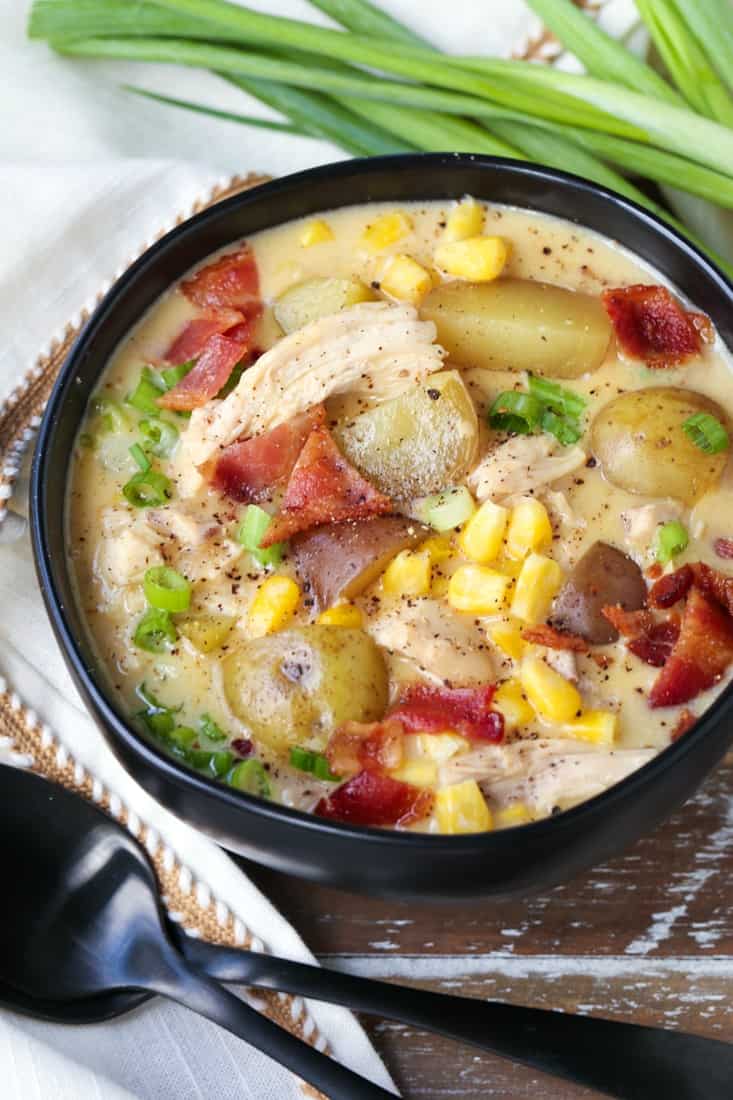 chicken corn chowder in a bowl with napkin