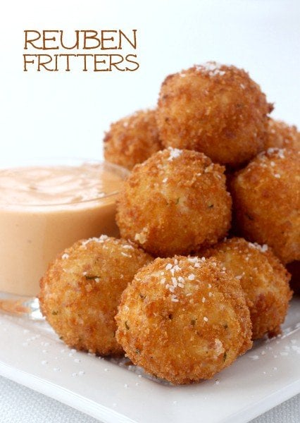 Reuben Fritters stacked on a plate with Thousand Island Dressing