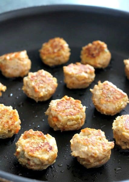 Chicken Enchilada Meatballs cooking in skillet