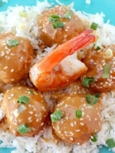 shrimp meatballs with glaze over rice