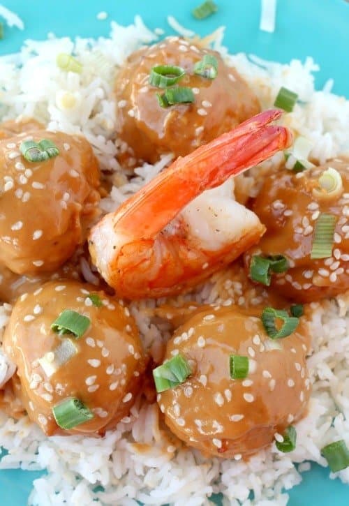 These Get ready to savor the taste of our unique Thai Shrimp Meatballs! Shrimp and pork blended with Asian flavors, glazed with peanut sauce. shrimp meatballs with glaze over rice