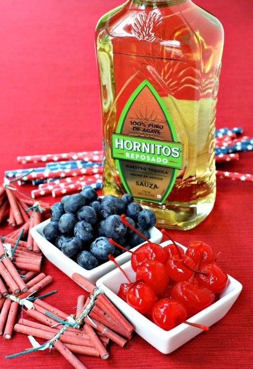 Tequila bottle with fresh fruit to make a tequila cocktail