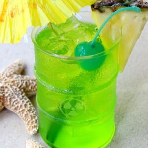 green midori cocktail with umbrella