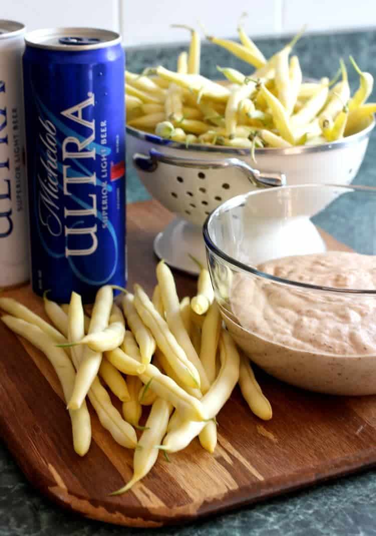 These crispy, Beer Battered Green Beans are a party favorite! Fried green beans in a light beer batter, dipped in a creamy barbecue sauce! Beer Battered Green Beans process