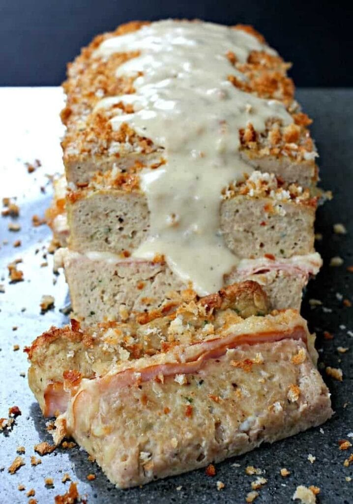 Chicken Cordon Bleu Meatloaf is a meatloaf recipe that is served with a mustard gravy on top