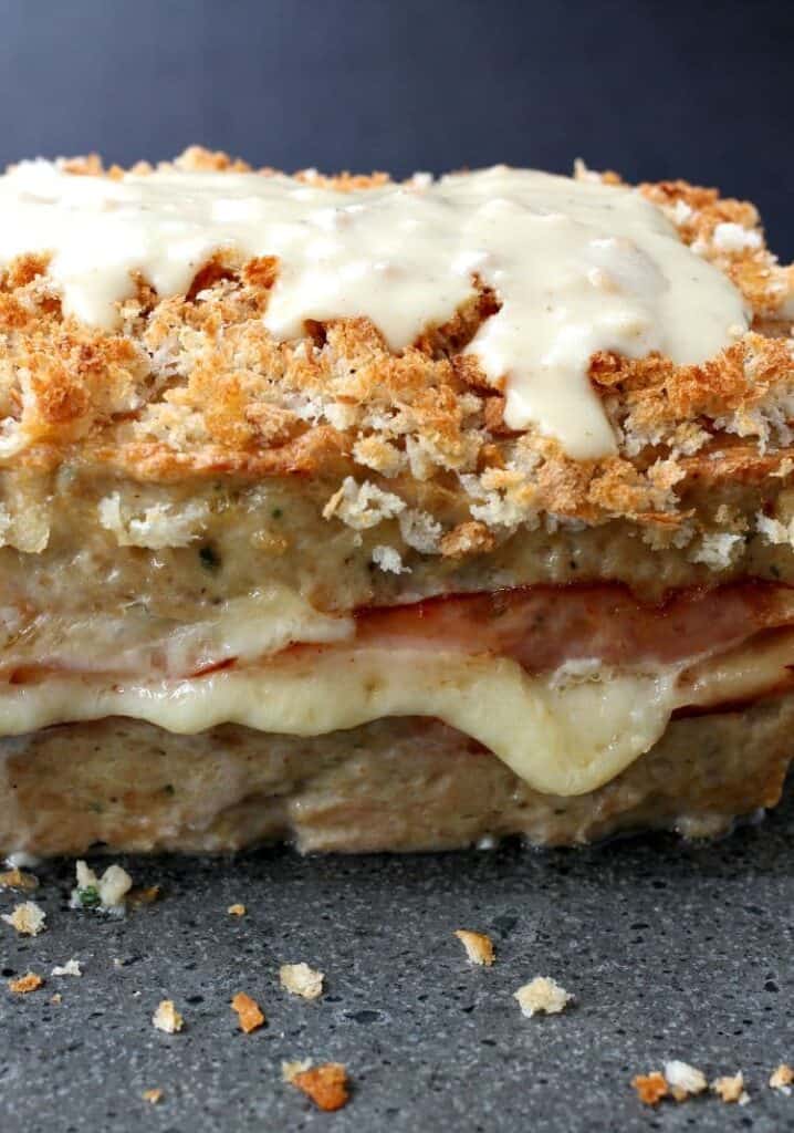 Chicken meatloaf with cheese dripping out the side