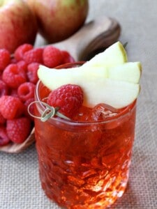 Raspberry Cider Whiskey is a cold cider cocktail with whiskey and raspberries