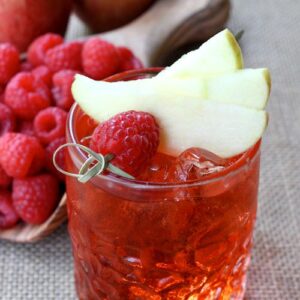 Raspberry Cider Whiskey is a cold cider cocktail with whiskey and raspberries