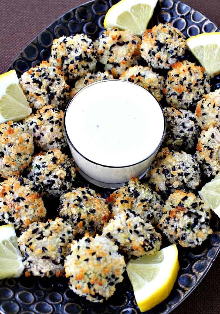 Sesame Shrimp Bites with Lemon Aioli on a platter with lemon wedges