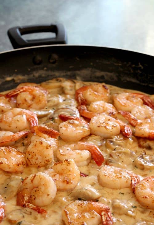 Make this delicious Shrimp with Cream Sauce for a dinner party or a date night at home! Anyone will be impressed with this delicious shrimp dinner! shrimp in skillet