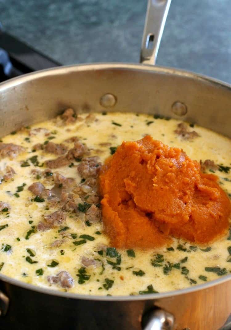 Pasta with Pumpkin Cream Sauce is my kind of fall comfort food! Pasta swimming in a creamy, pumpkin sauce with sausage and fresh herbs! pasta-pumpkin-cream-sauce-skillet